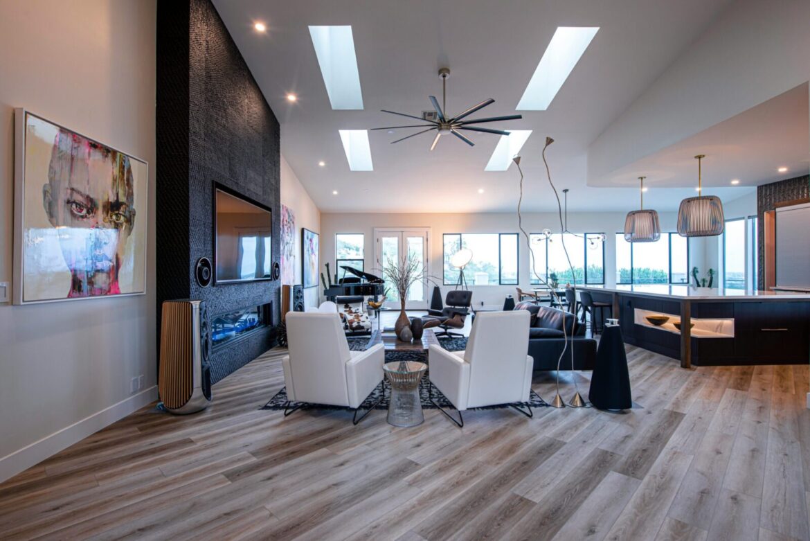 A modern and spacious living room with high ceilings and stylish decor.