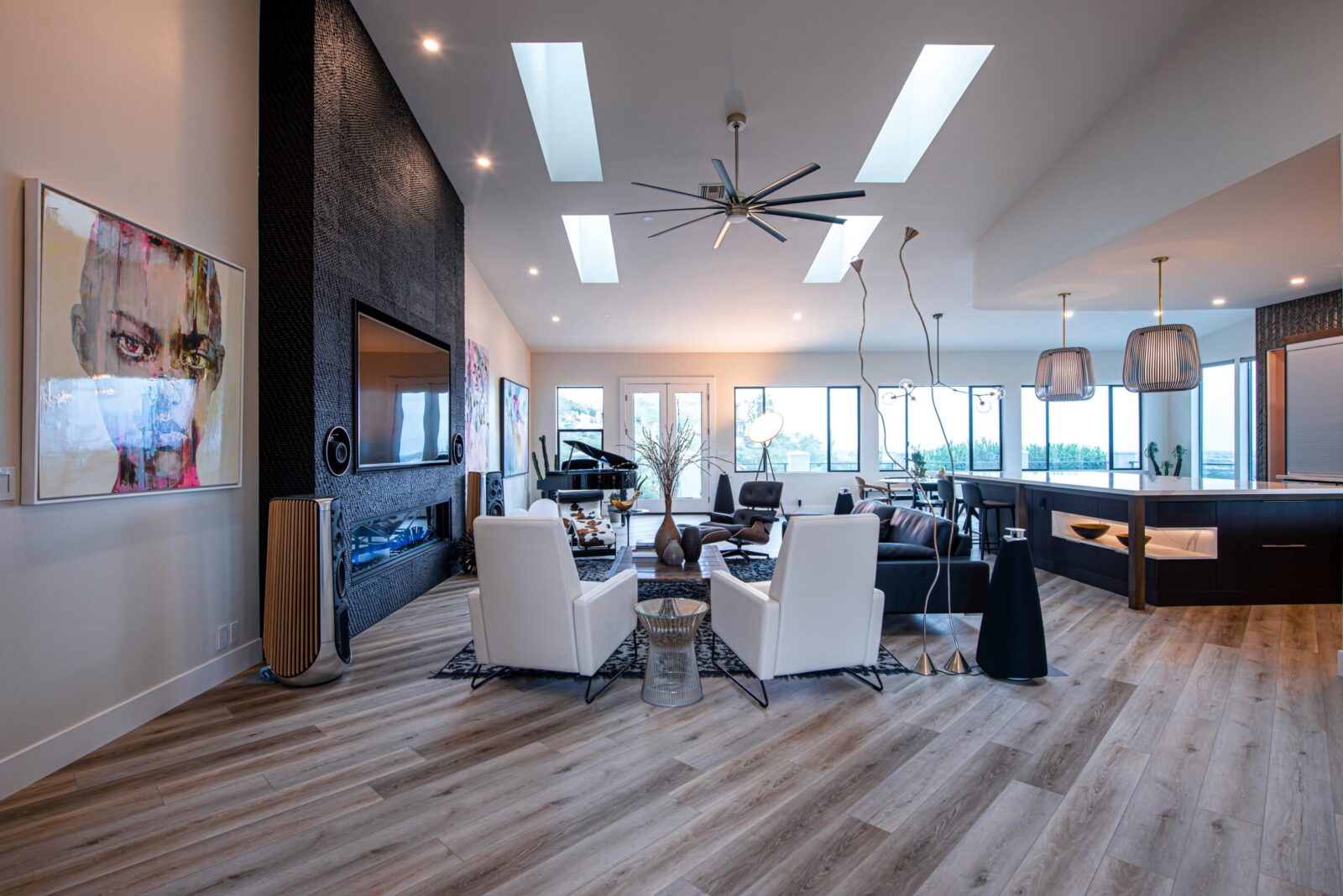 A modern and spacious living room with high ceilings and stylish decor.