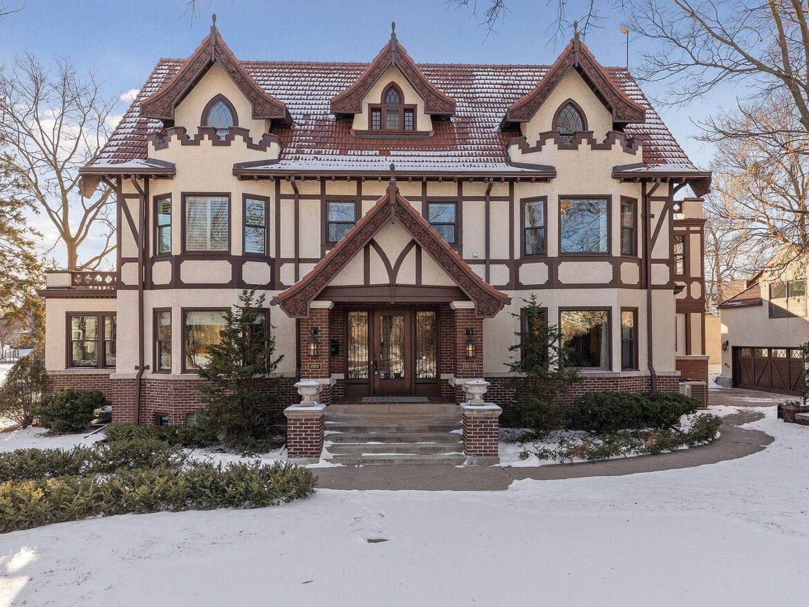 Timeless and Elegant 1909 Tudor Mansion in Minneapolis, Featuring Stunning Millwork, a Carriage House, and Proximity to the Scenic Lake of the Isles